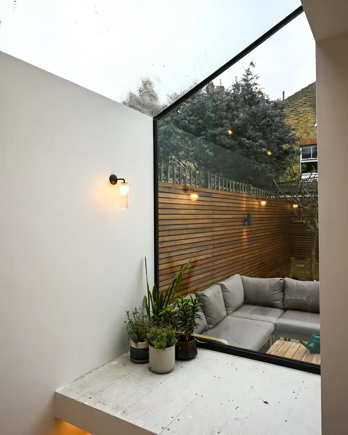 New glass roof and projected glass bay over the side extension, looking out to the garden, Putney SW15