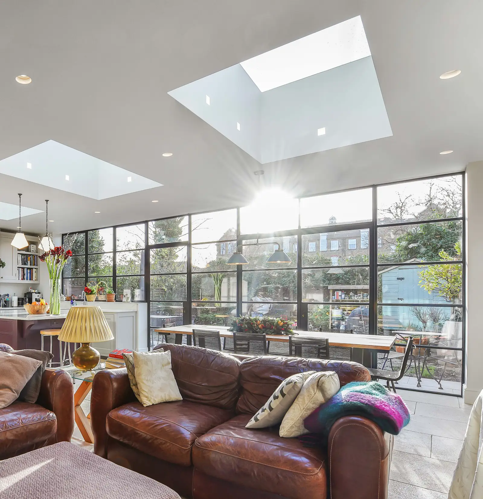 Rooflights and Crittall-style glazing lighting an open plan kitchen, dining and living extension, Wimbledon SW19