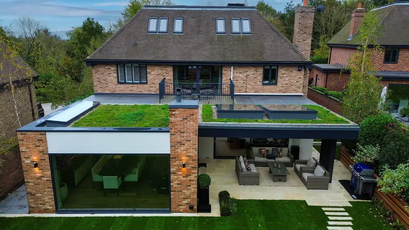 Aerial view of a rear extension with a wildflower sedum roof and rooflights, Hertfordshire